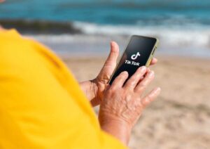 TikTok Video Marketing,TikTok, Marketing, blog tips, engage, entertain, hashtags, partnerships, clickable CTAs, captions